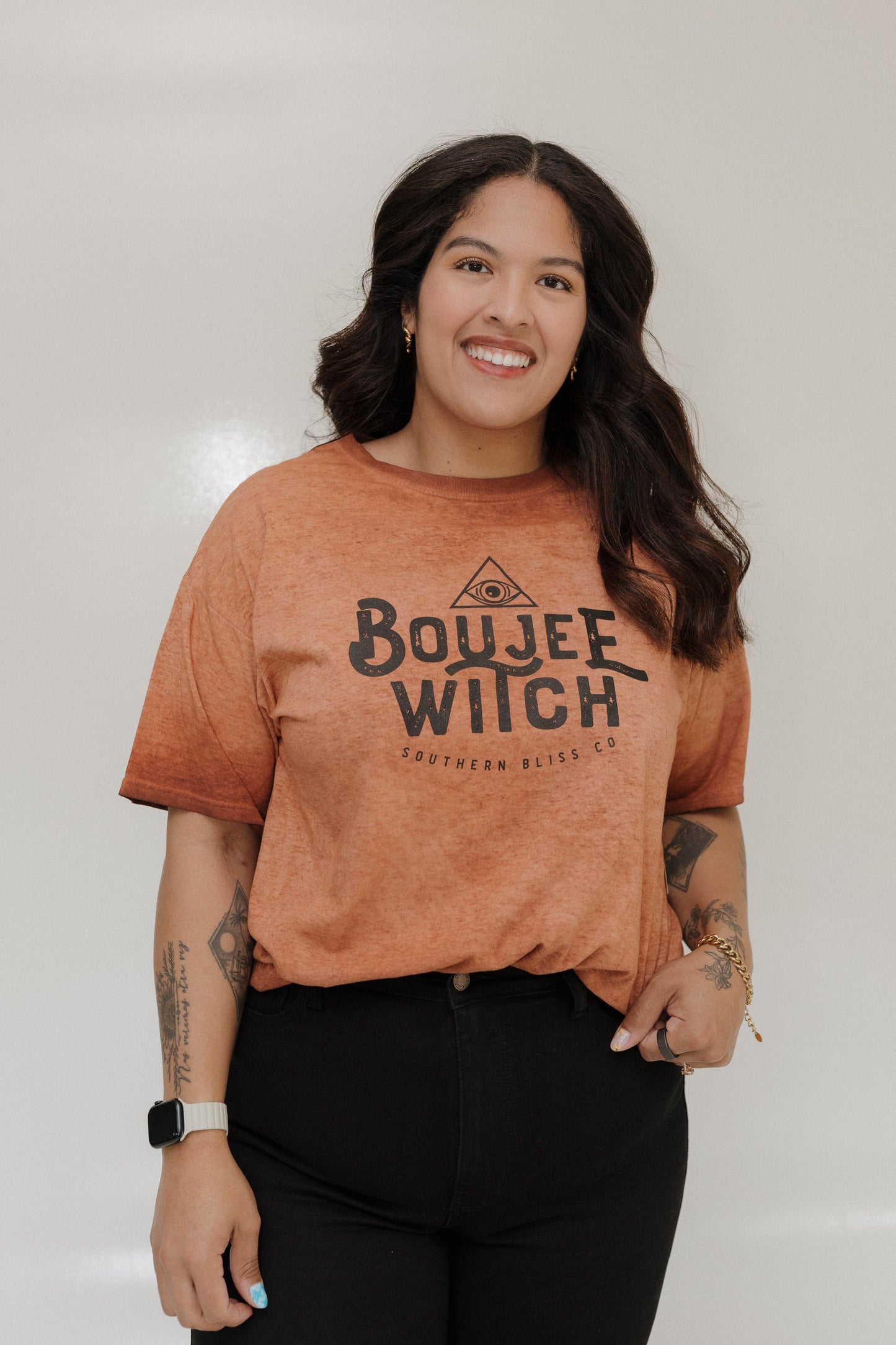 "BOUJEE WITCH" GRAPHIC TEE Woman wearing a brown t-shirt with 'Boujee Witch' text against a plain background at Love Marlow