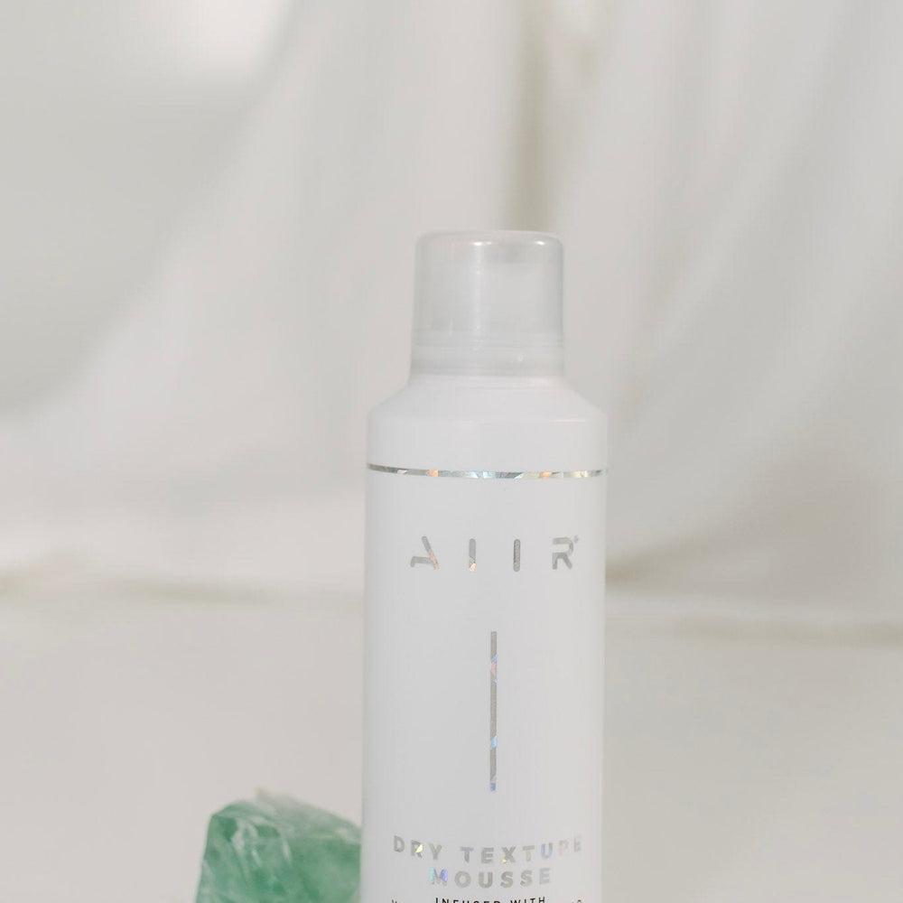 White bottle with 'AIIR' branding on a white background