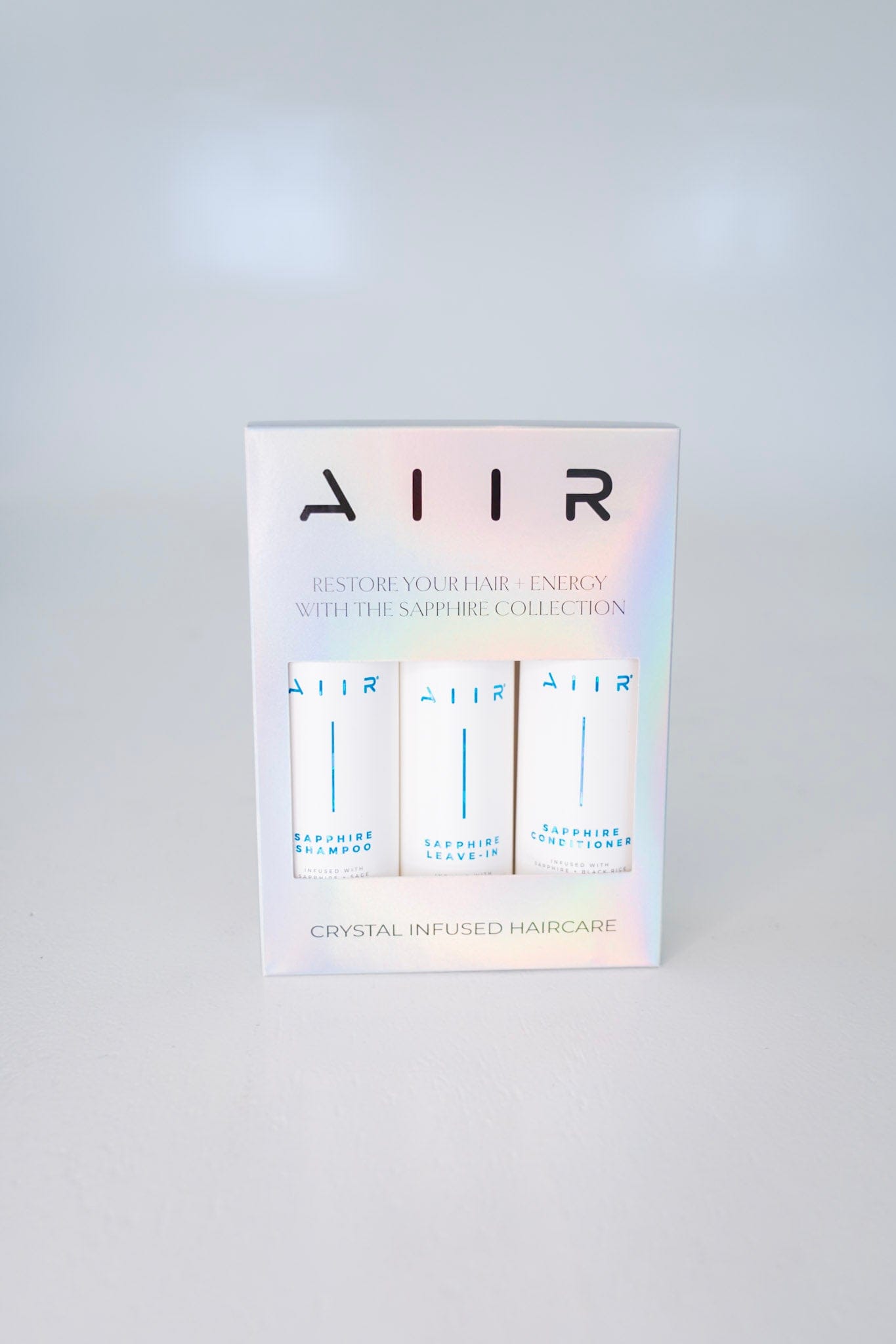AIIR hair care product packaging on a white background