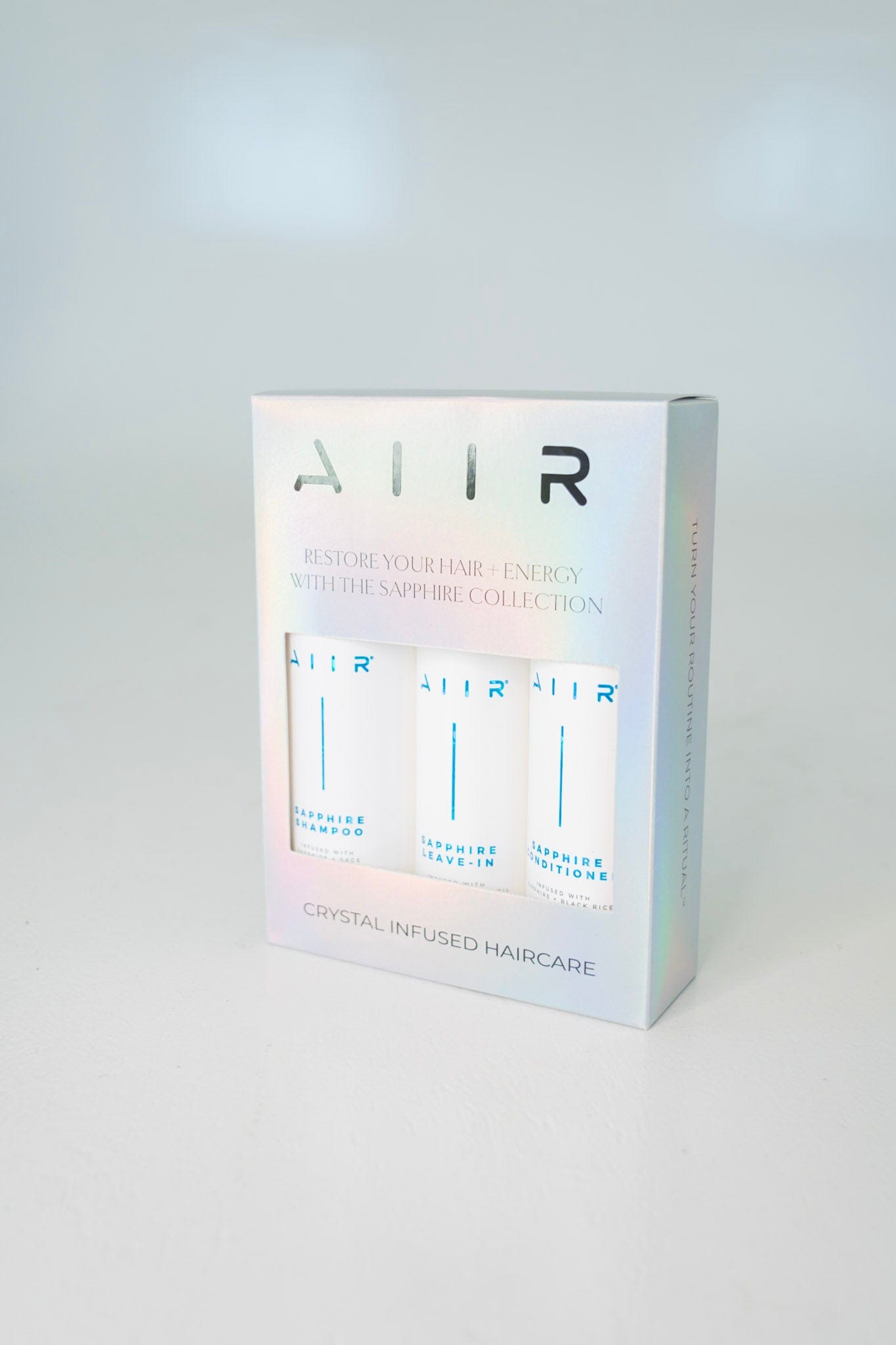 AITR hair care product packaging on a white background
