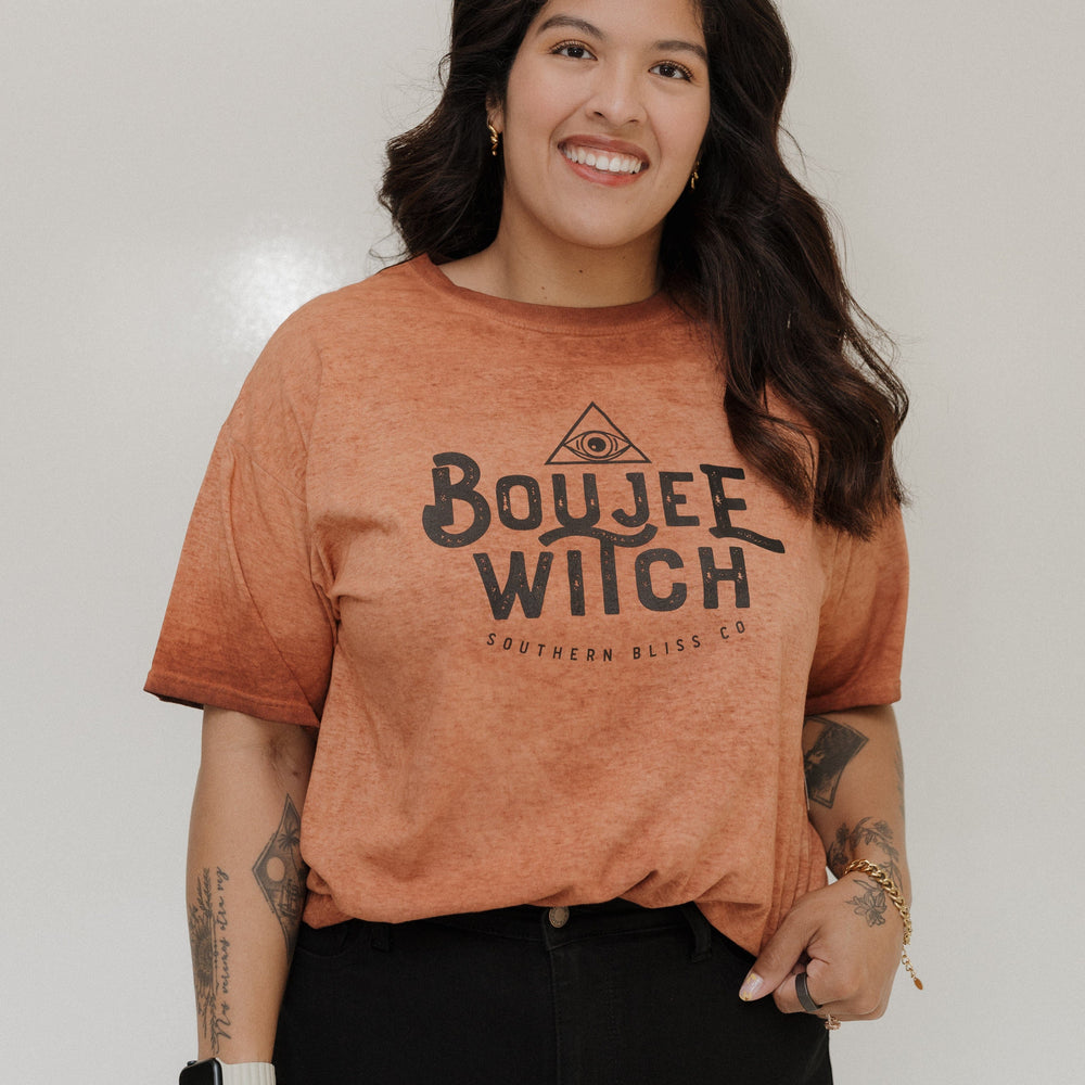 "BOUJEE WITCH" GRAPHIC TEE Woman wearing a brown t-shirt with 'Boujee Witch' text against a plain background at Love Marlow