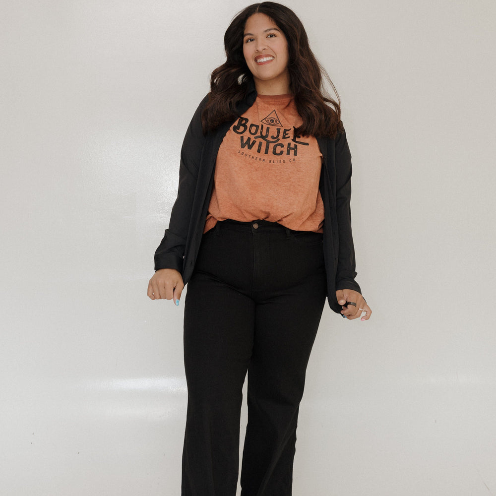 "BOUJEE WITCH" GRAPHIC TEE Woman wearing a brown t-shirt with 'Boujee Witch' text against a plain background at Love Marlow