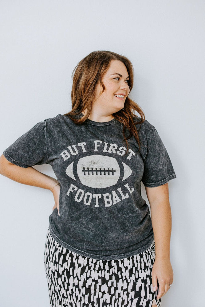 "BUT FIRST FOOTBALL" GRAPHIC TEE IN MINERAL WASH BLACK