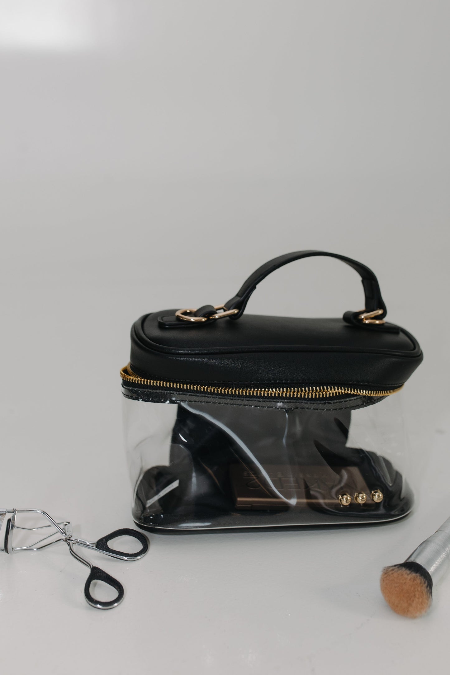 Black handbag on a white background