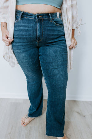 
            
                Load image into Gallery viewer, JUDY BLUE DARK WASH RAW HEM BOOTCUT JEANS
            
        
