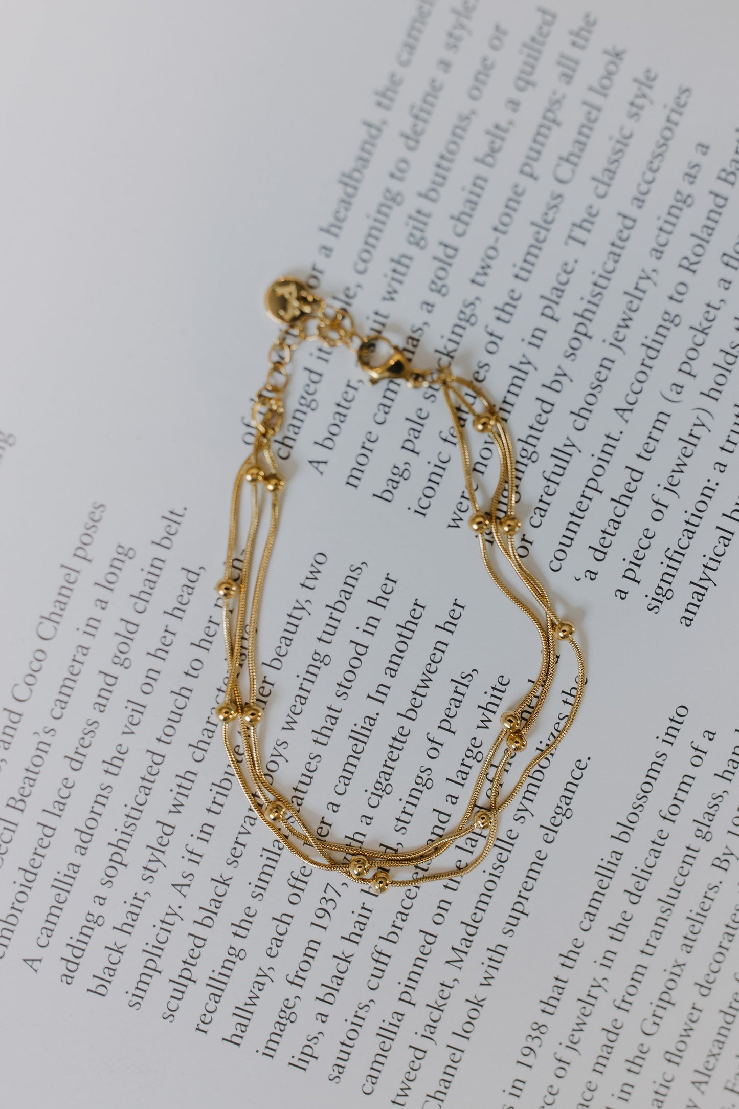 Gold bracelet on a book page