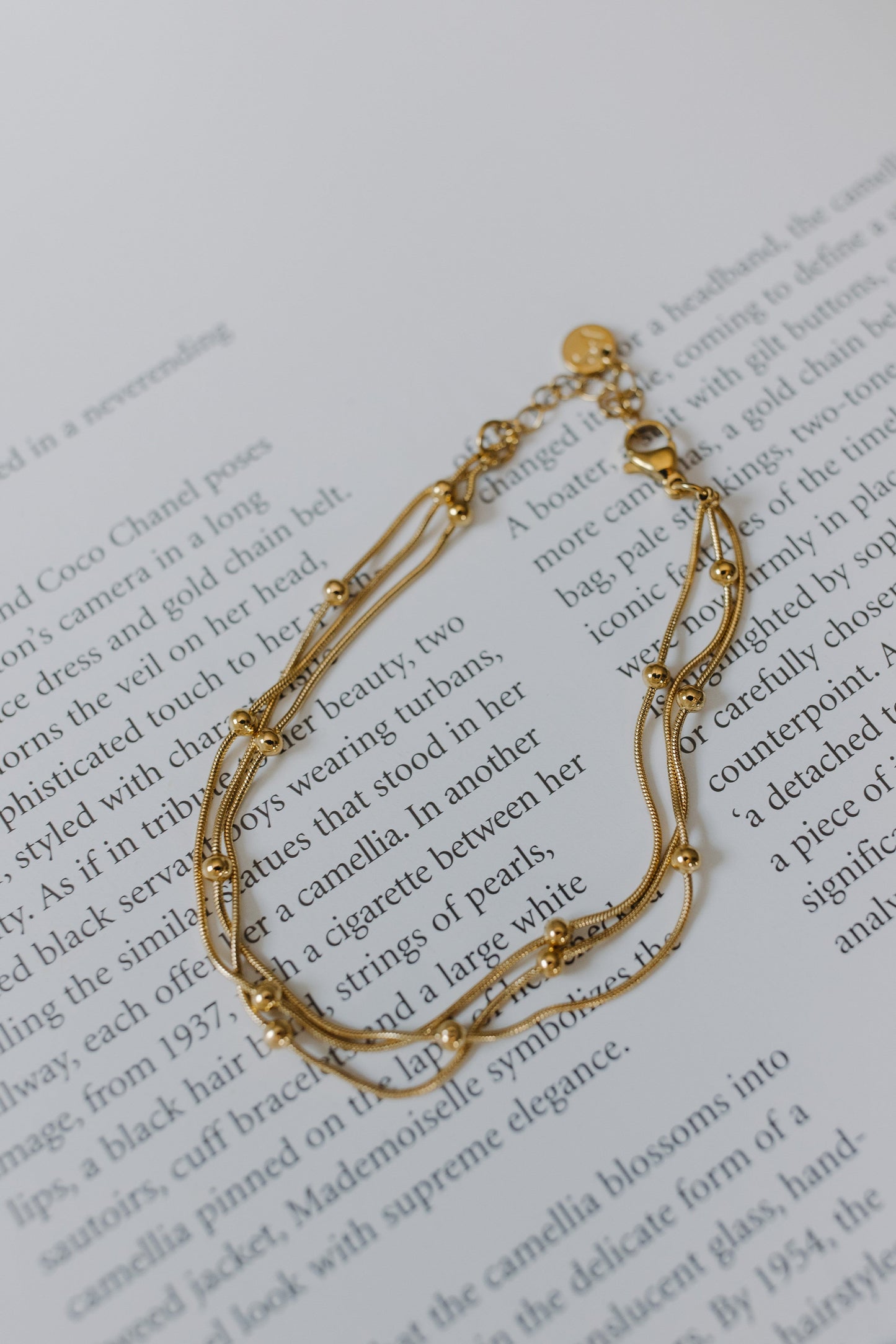 Gold bracelet on a book page