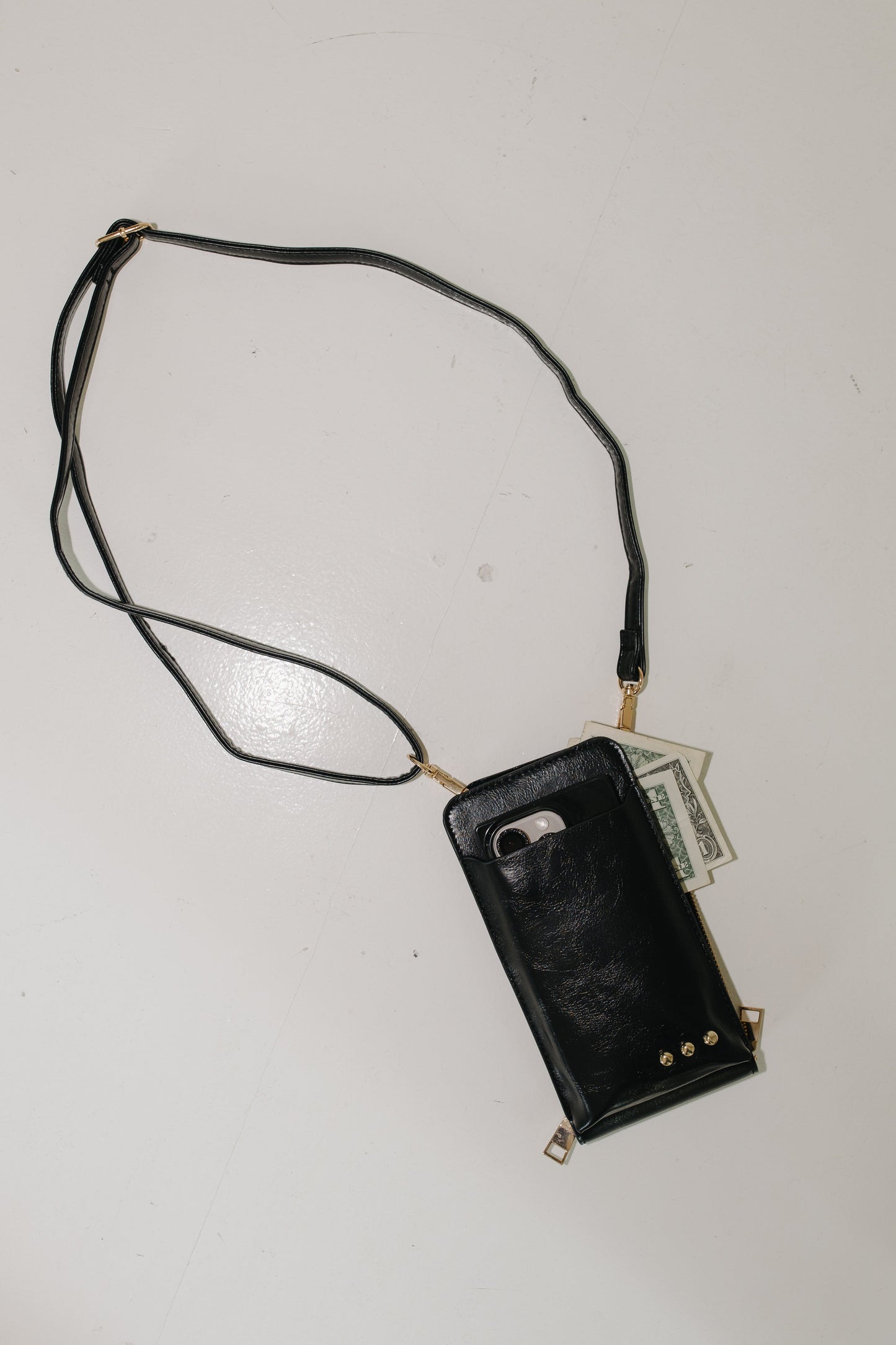 Black phone case with a lanyard on a white background