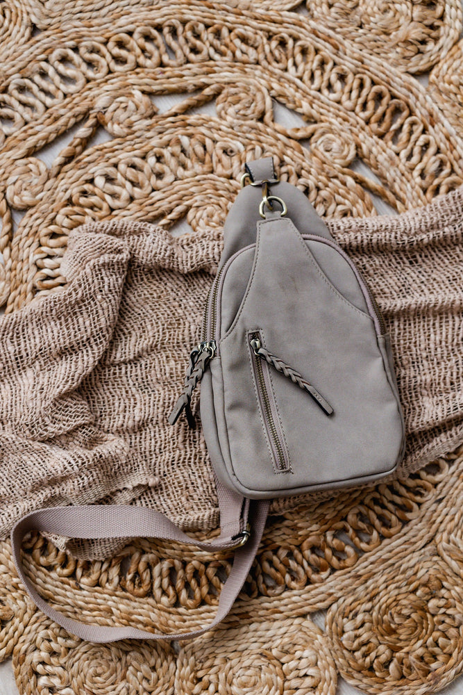 FAUX SUEDE SLING BAG IN CONCRETE