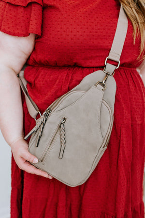 
            
                Load image into Gallery viewer, FAUX SUEDE SLING BAG IN CONCRETE
            
        