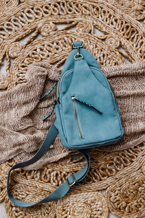 
            
                Load image into Gallery viewer, FAUX SUEDE SLING BAG IN GREY BLUE
            
        