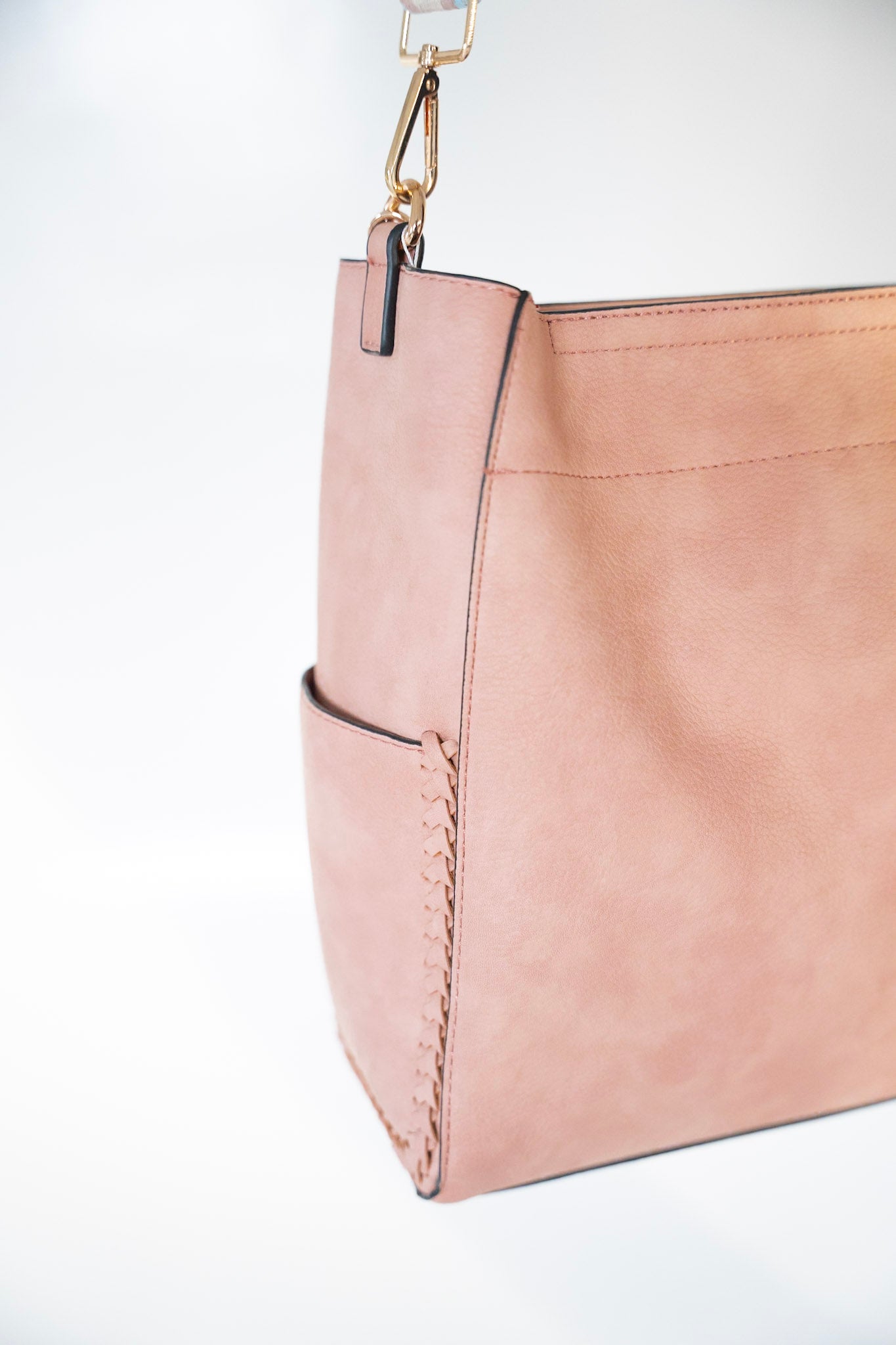 FAUX LEATHER SATCHEL WITH BRAIDED DETAIL IN PINK 
Large pink tote bag with geometric strap