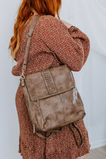 FLAPOVER BACKPACK IN DUSTED TRUFFLE