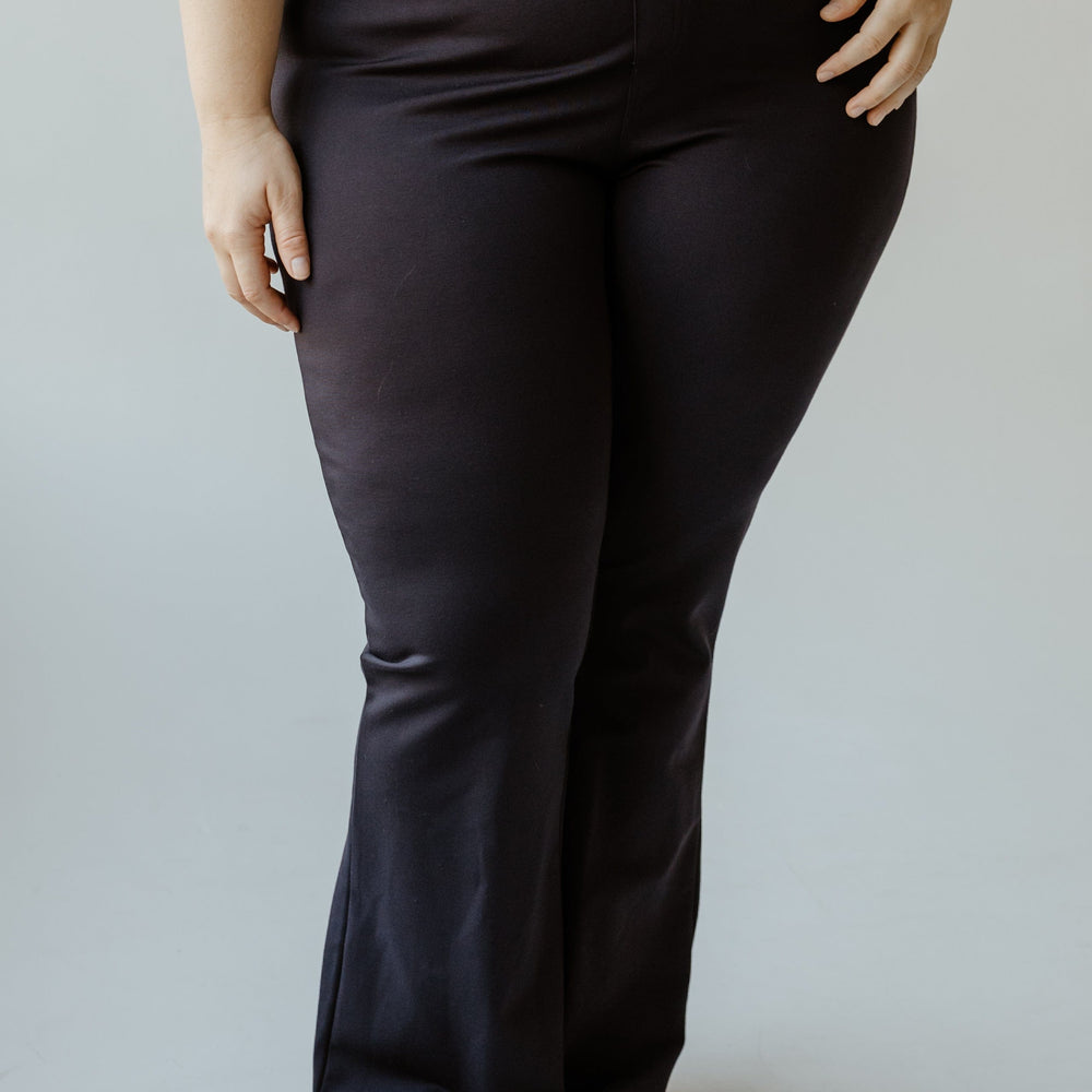 A person wearing the ultra-stylish Flare Tregging in Navy by Yesta.