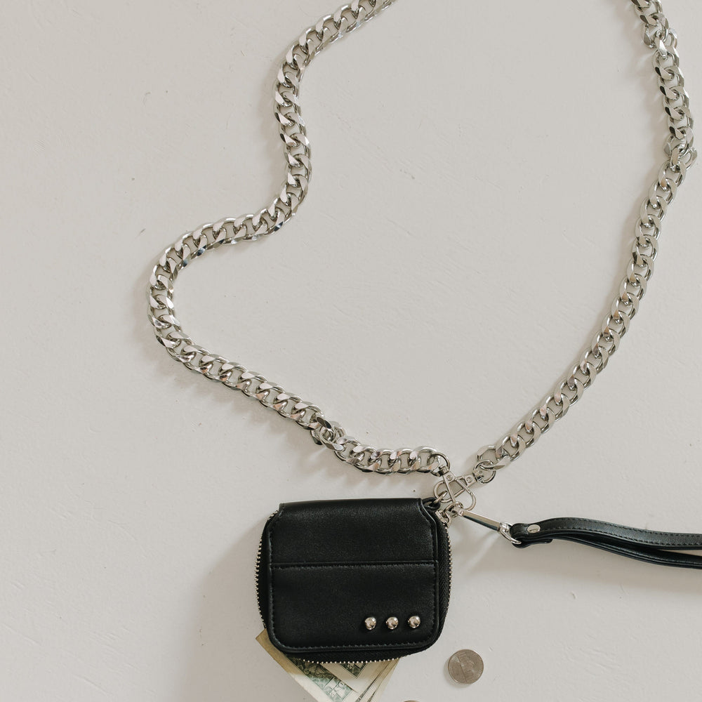 Black wallet with chain on a white background