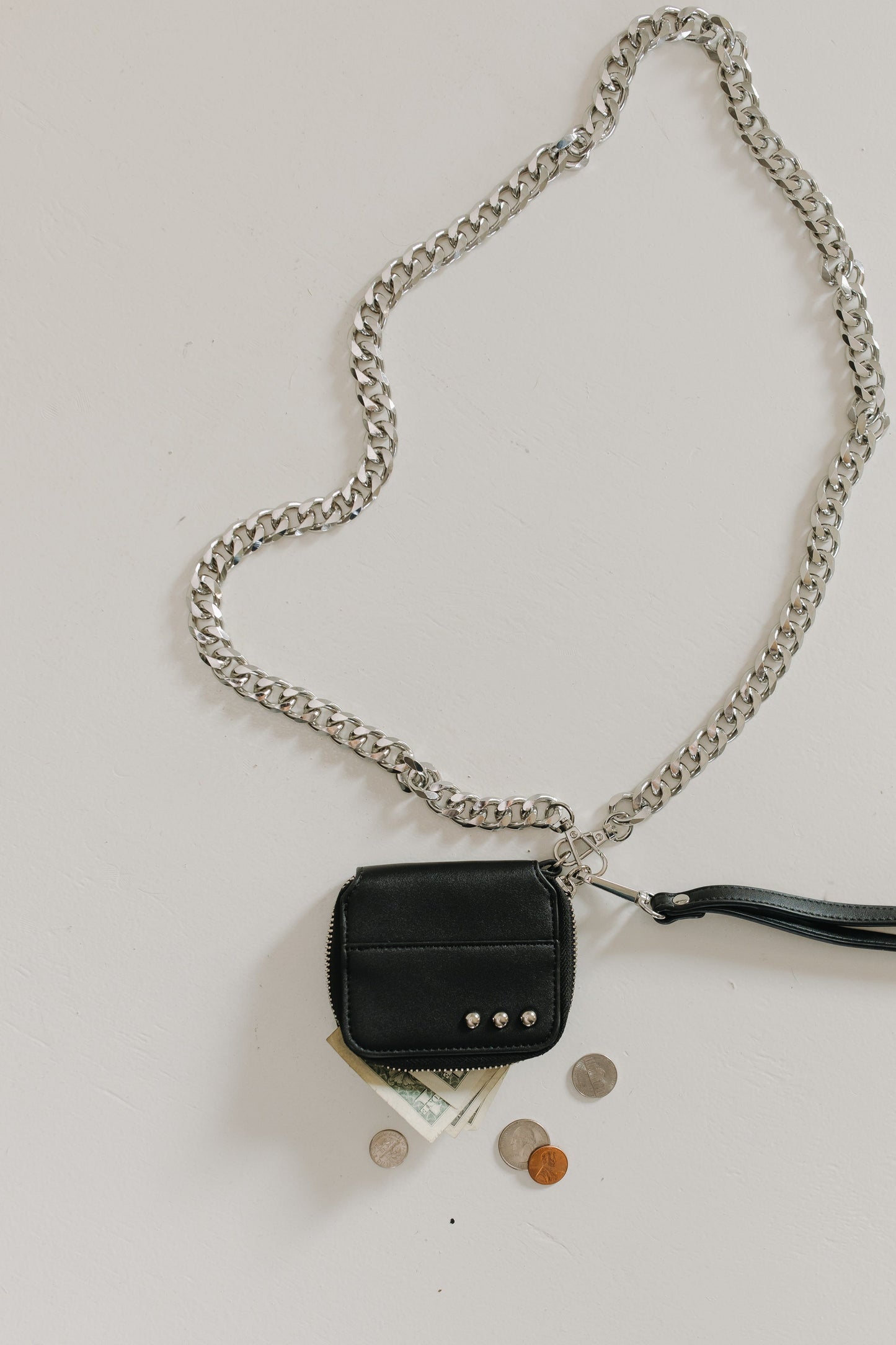 Black wallet with chain on a white background