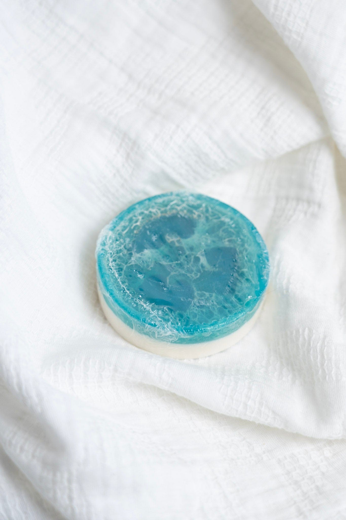 Blue decorative soap on a white textured surface