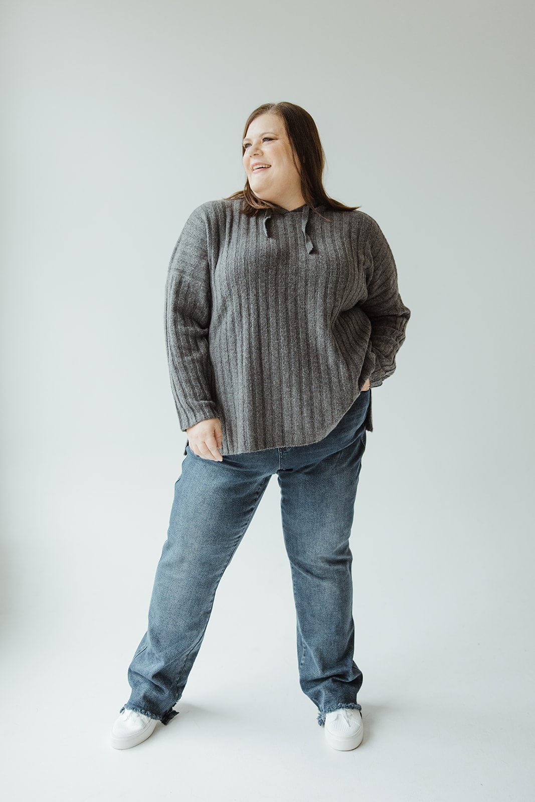 A person in a gray sweater and the Judy Blue High-Waisted Button-Fly Destroyed Hem Straight Leg jeans poses against a plain background.