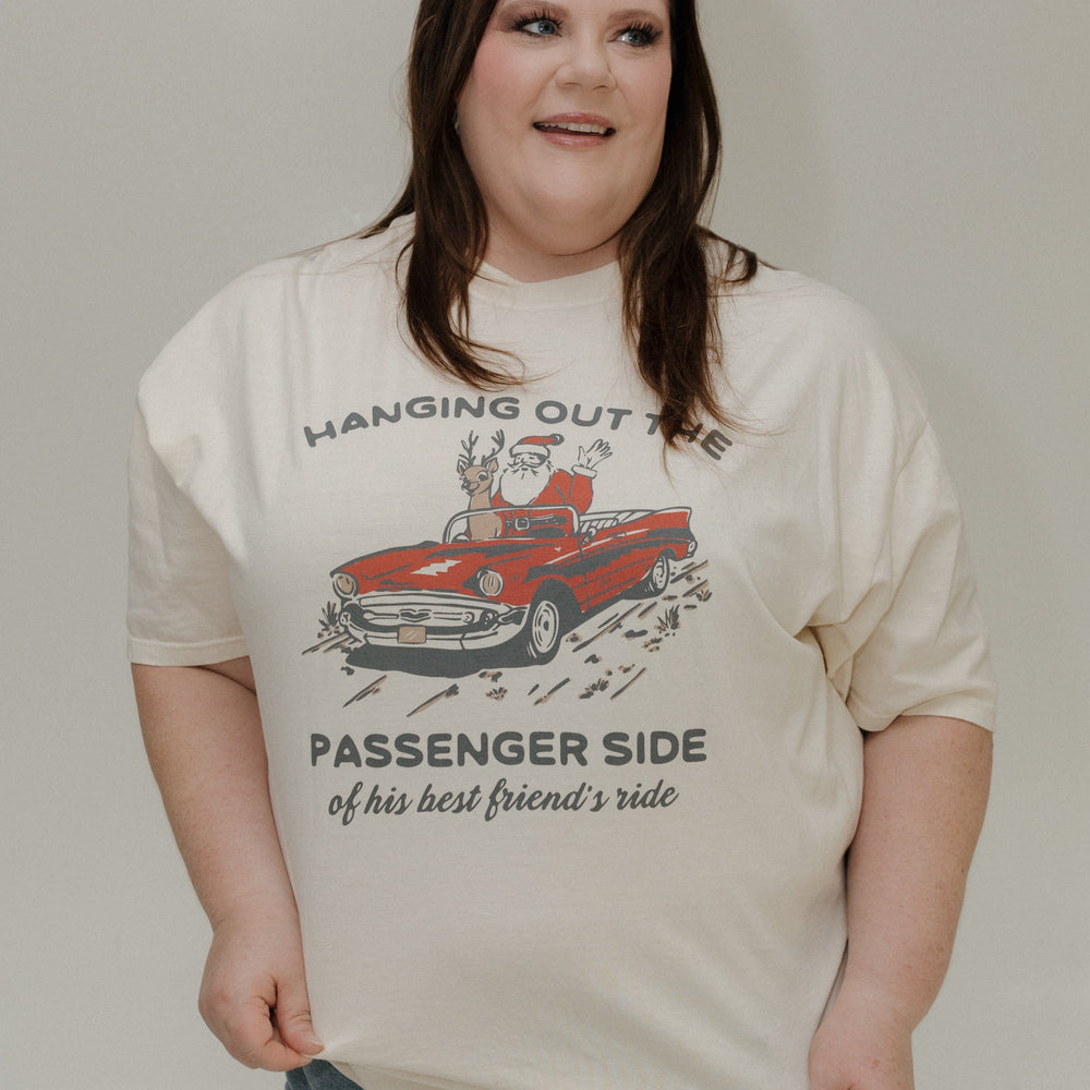 Person wearing a t-shirt with a graphic design and text.