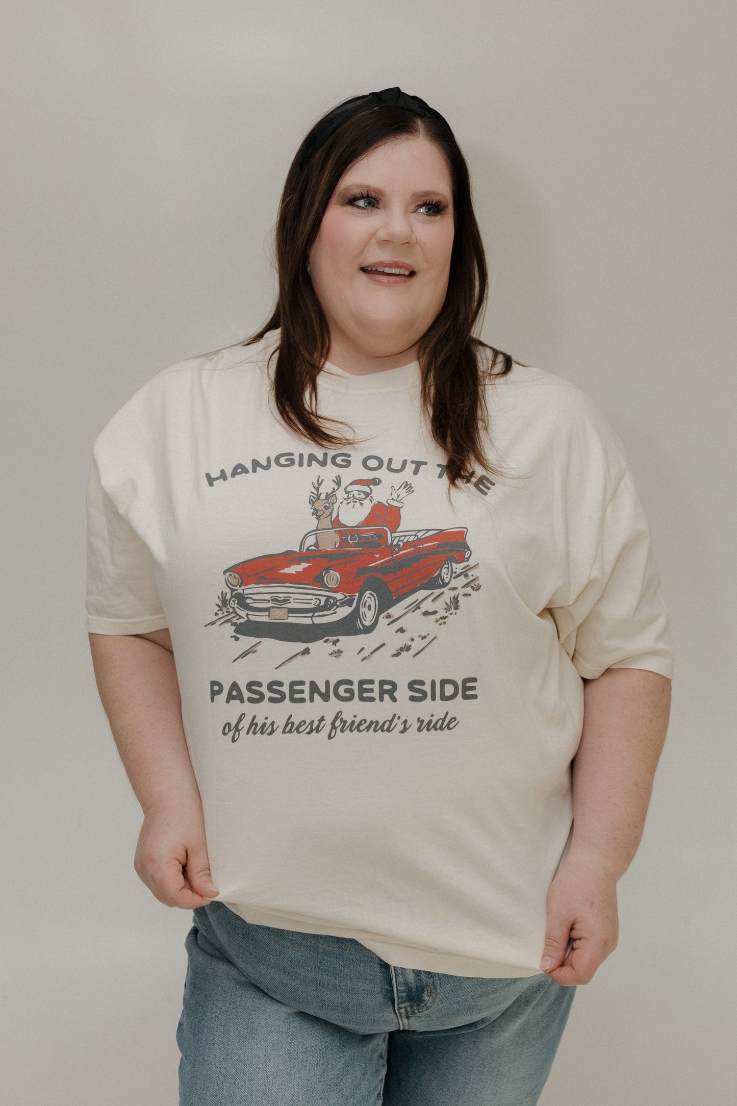 Person wearing a t-shirt with a graphic design and text.