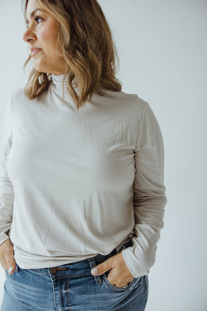 JERSEY KNIT LONG-SLEEVE TURTLENECK IN CREAM