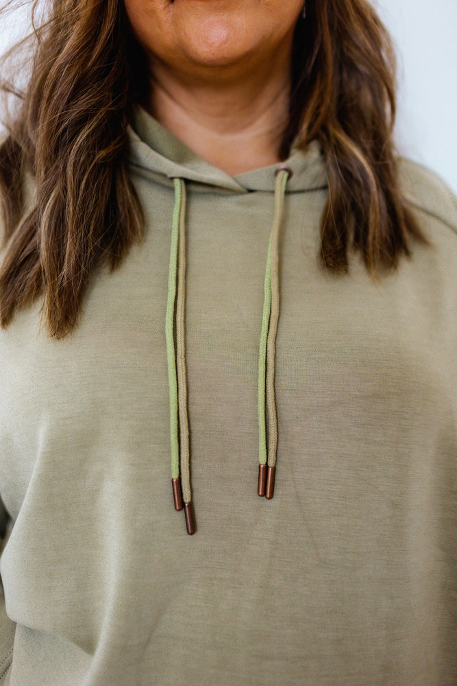 
            
                Load image into Gallery viewer, LIGHT AS AIR DOUBLE-STRING HOODIE IN OM GREEN
            
        
