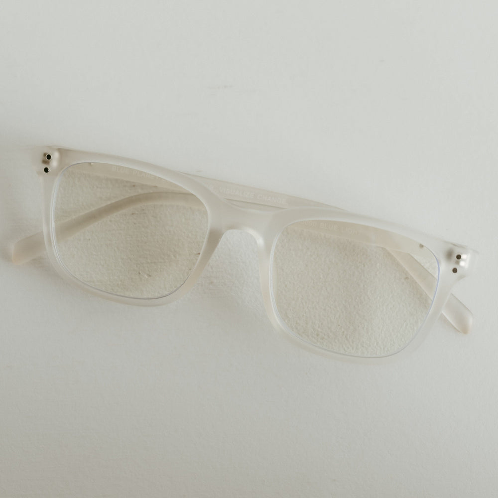 Clear sunglasses on a light gray background