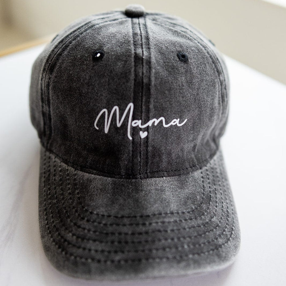 An acid-washed gray baseball cap with "Mama" embroidered in white script on the front is the perfect Mother's Day gifting idea.