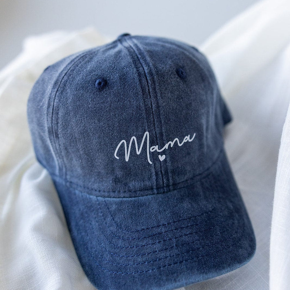 This Love Marlow cap, named "MAMA" Acid Washed Baseball Cap in Navy, features an acid-washed design with "Mama" elegantly scripted in white on the front.