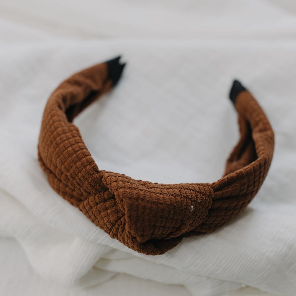 Milk chocolate waffle texture headband with white background. 