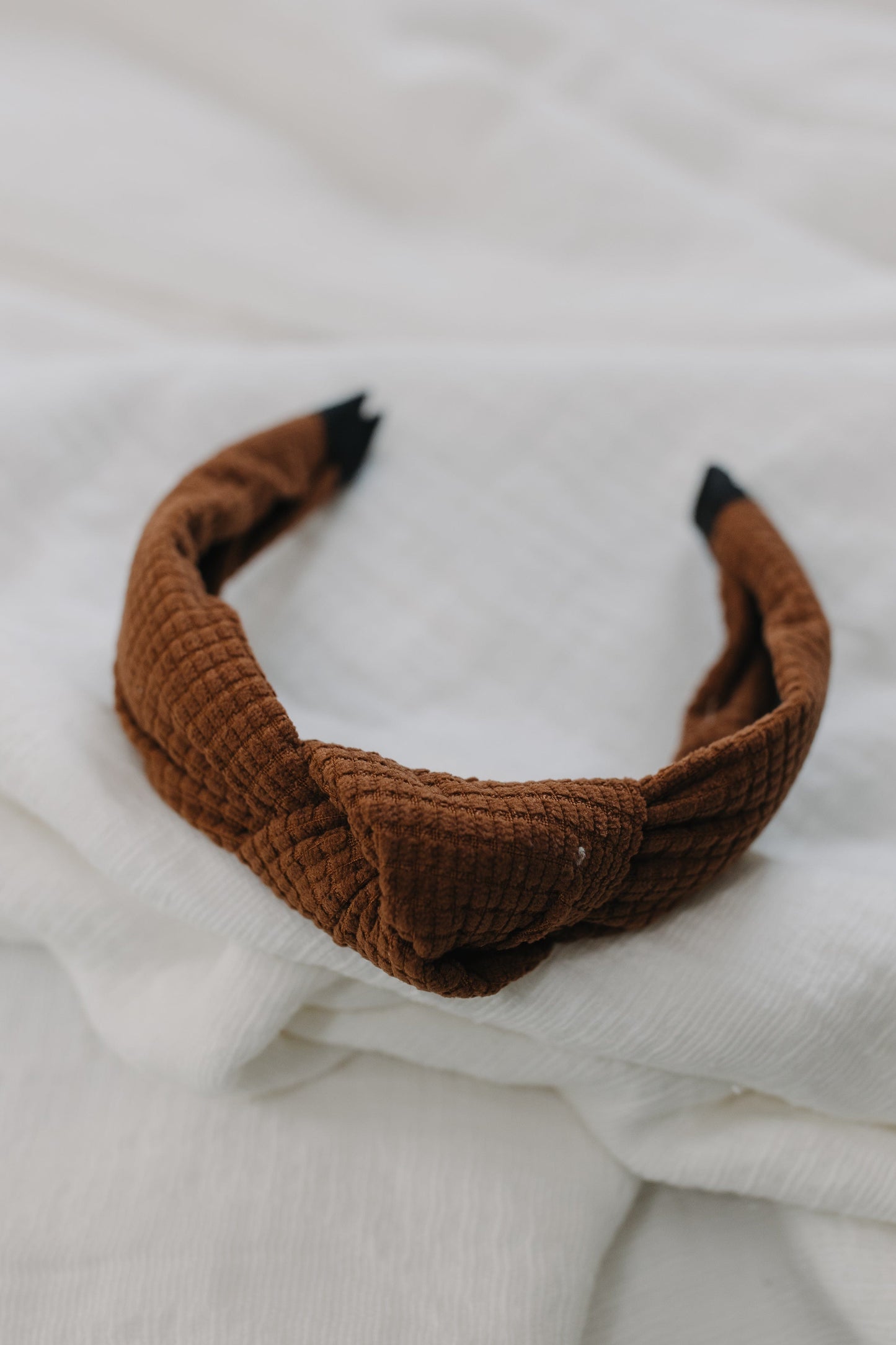 Milk chocolate waffle texture headband with white background. 