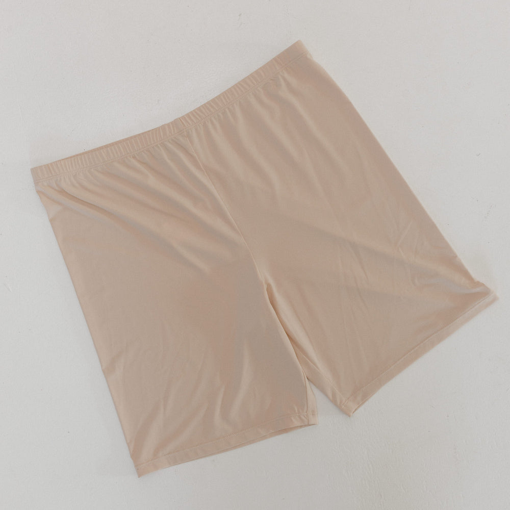 Beige shorts on a light gray background