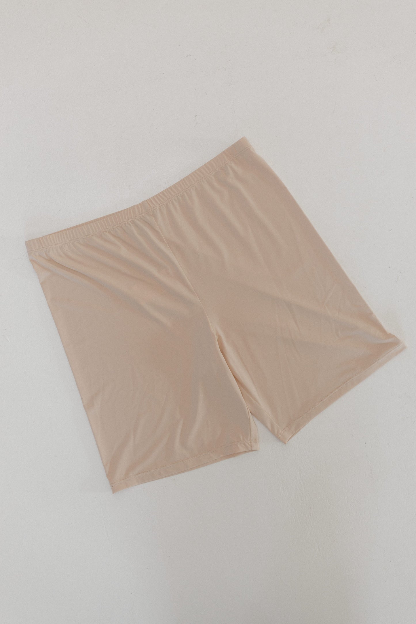Beige shorts on a light gray background