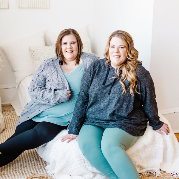 Leslie and Stacey Malmgren pose wearing their Love Marlow clothing