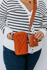 QUILTED CROSSBODY SLING BAG IN BROWN