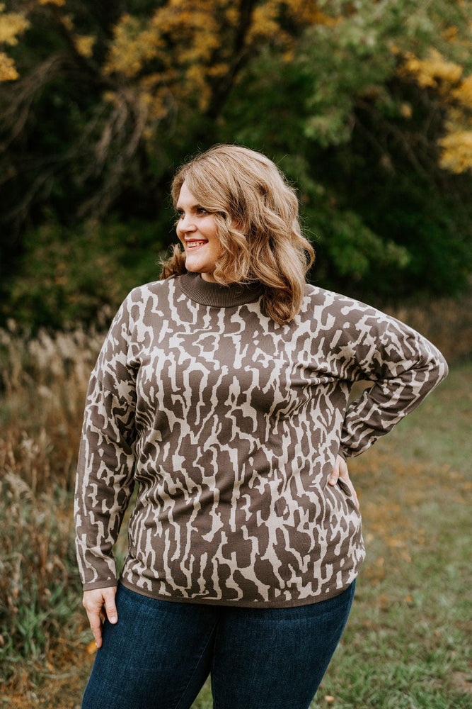 
            
                Load image into Gallery viewer, RIBBED MOCK NECK ANIMAL PRINT SWEATER
            
        