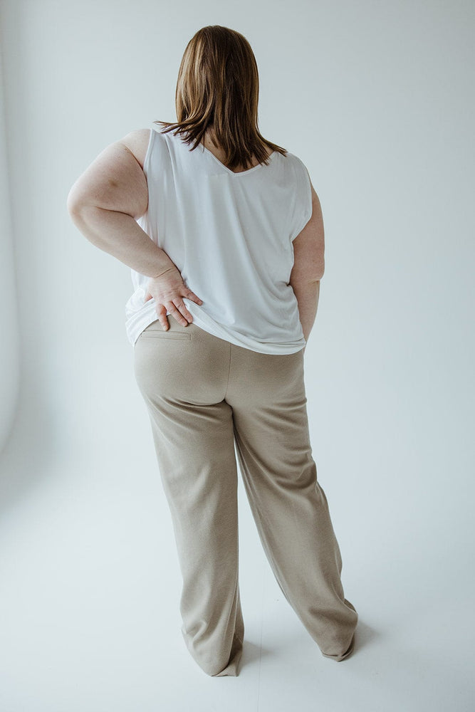 A person stands in a white sleeveless top and Yesta's Light Khaki Straight Leg Pull-On Pants with smoothing technology, photographed from behind against a plain white background.