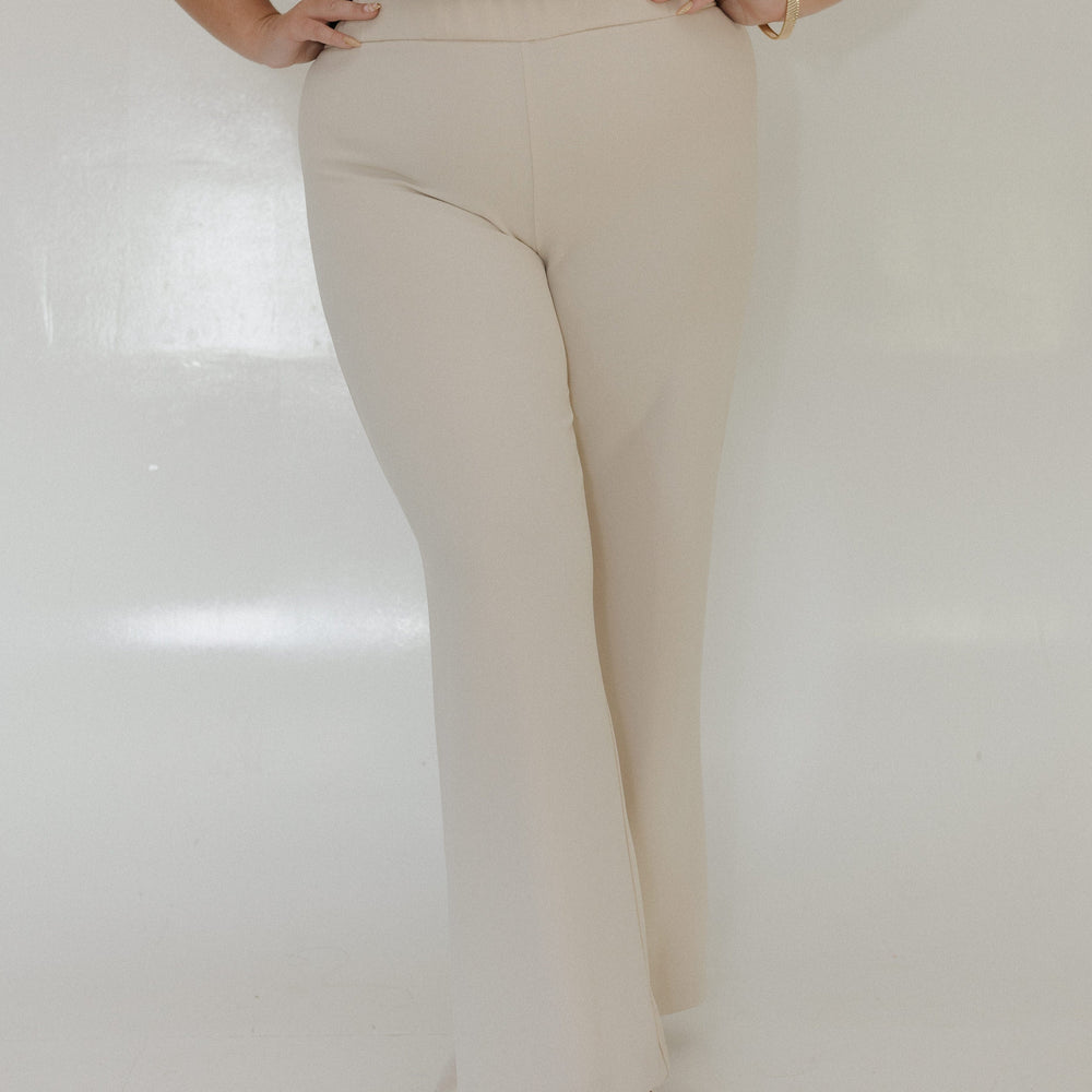 SAND STRAIGHT LEG PULL-ON PANT Model wearing beige pants and a black top on a white background Love Marlow