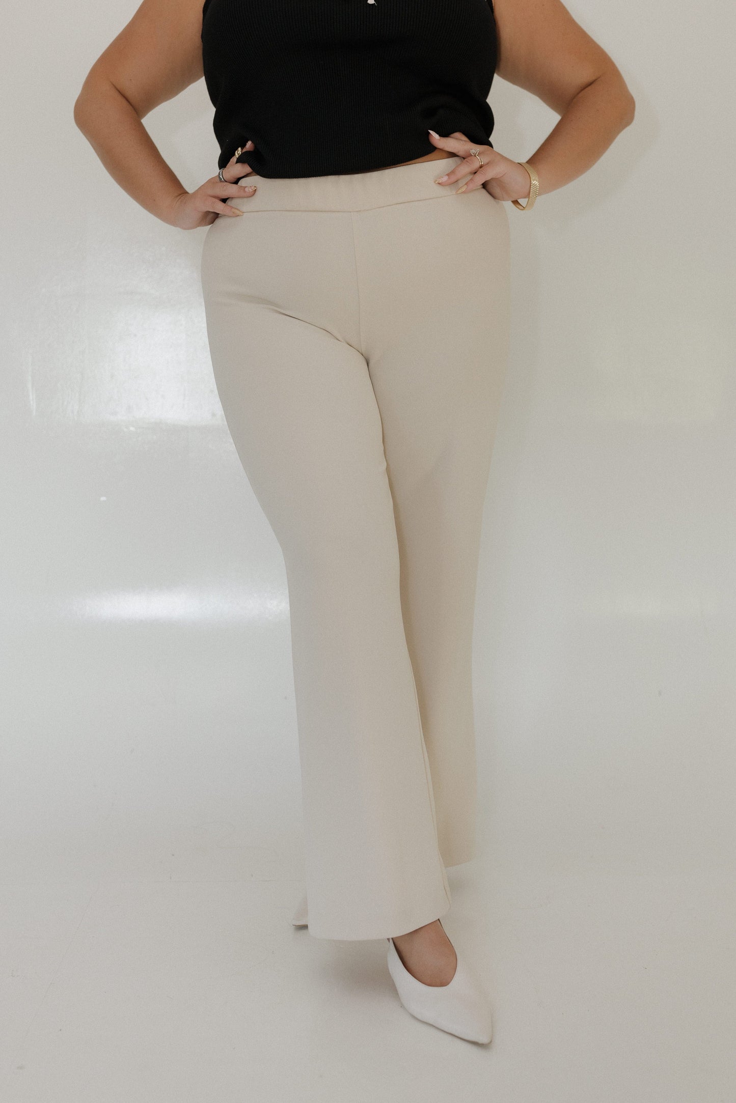 SAND STRAIGHT LEG PULL-ON PANT Model wearing beige pants and a black top on a white background Love Marlow