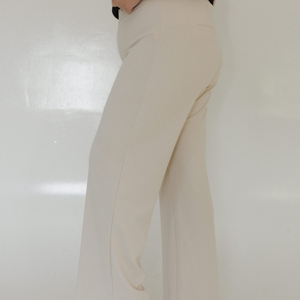 SAND STRAIGHT LEG PULL-ON PANT Model wearing beige pants and a black top on a white background Love Marlow