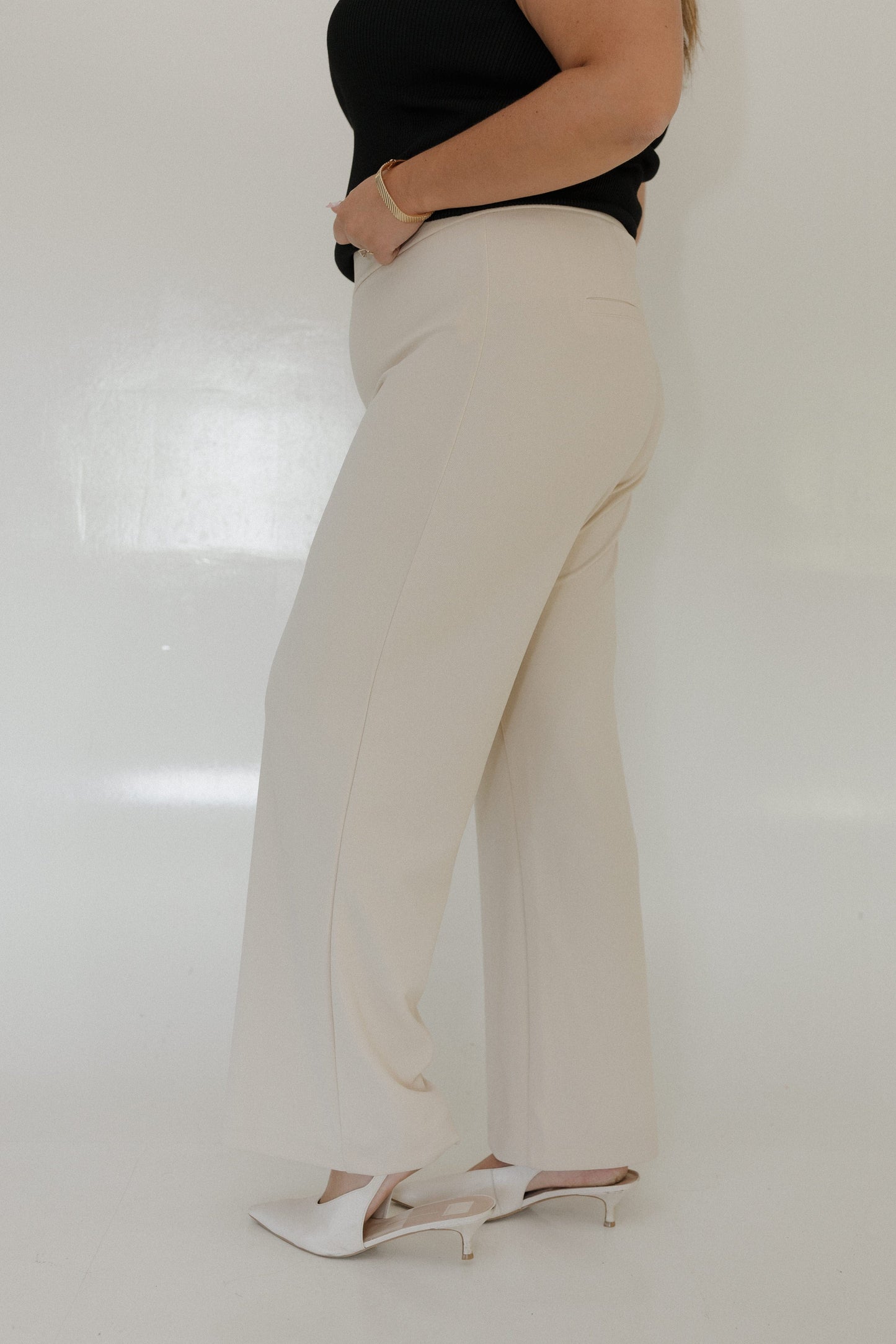 SAND STRAIGHT LEG PULL-ON PANT Model wearing beige pants and a black top on a white background Love Marlow