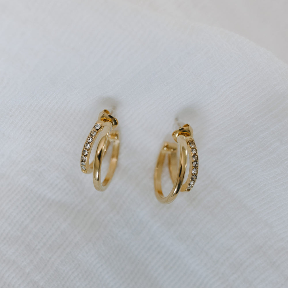 Gold hoop earrings on a white background