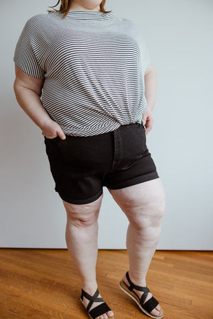 
            
                Load image into Gallery viewer, SLIGHTLY DISTRESSED TUMMY CONTROL CUFFED SHORTS IN BLACK
            
        