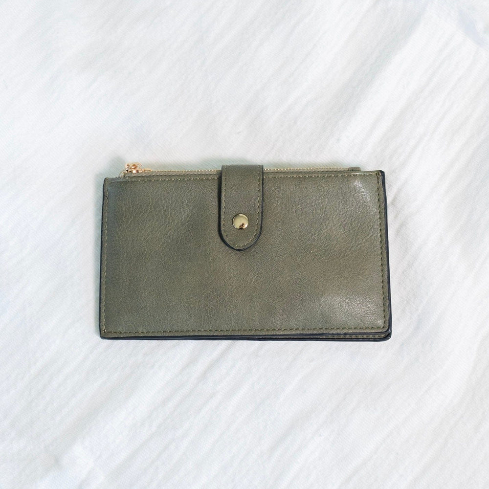You'll make a statement with this army green wallet! This album style wallet has so much room for your cards and cash! It has two zipper pockets with a snap to keep the wallet closed. It is RFID protected! You will be protecting your personal data with the use of RFID blocking technology! A metal fiber mesh creates a "cage" around the chip on credit cards that radio waves cannot penetrate! Protect yourself and look cute all at the same time!
