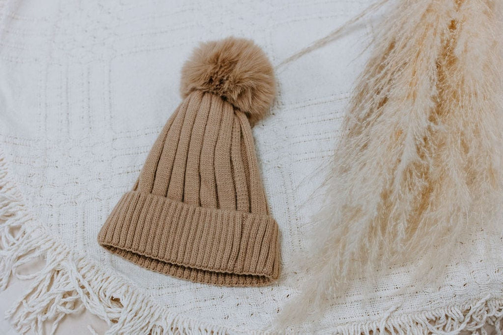 SOLID RIBBED KNIT BEANIE WITH PUFF IN TAUPE