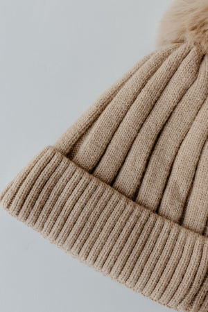 SOLID RIBBED KNIT BEANIE WITH PUFF IN TAUPE