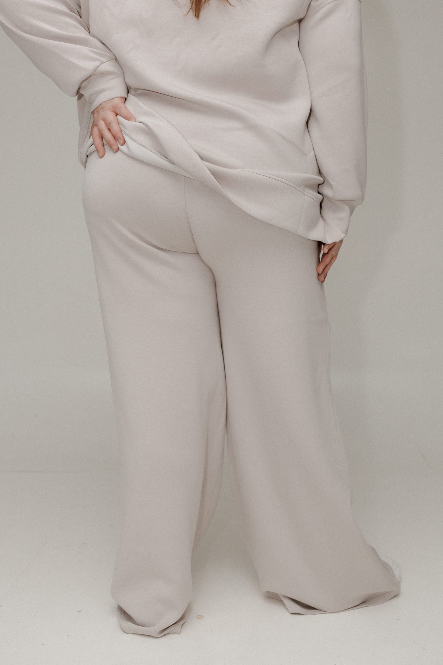 back of athleisure pants against a white background