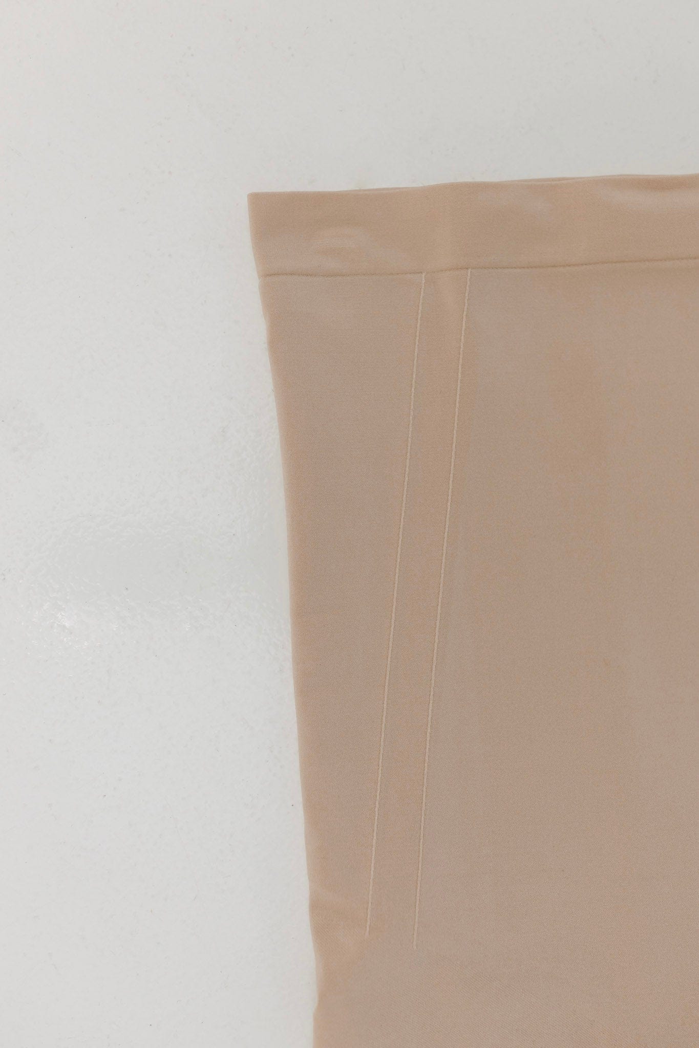 Beige fabric corner on a light gray background