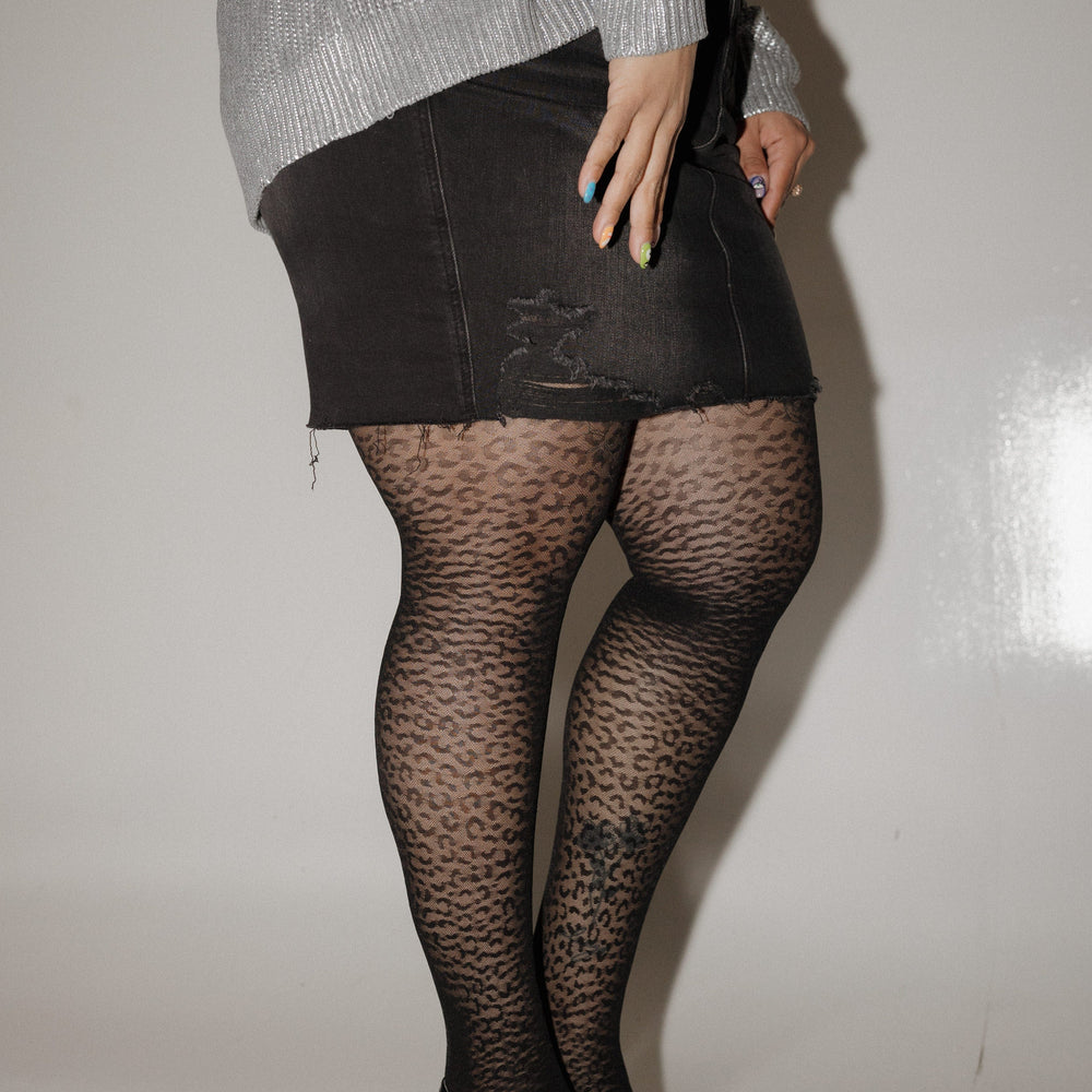 SPANXshape™ Leopard Fishnet Stockings against a white background 