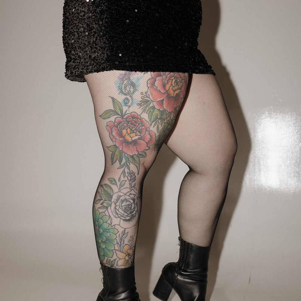 SPANXshape™ Micro Fishnet Stockings against a white background